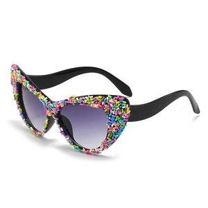 Cat-eye sunglasses with colorful sprinkle candy decorations and purple gradient lenses