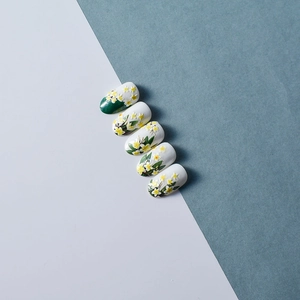 5D floral embossed press-on nails with yellow frangipani design and green leaf accents