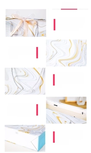 Detail of marble pattern gift bag showing reinforced handle and cream ribbon bow