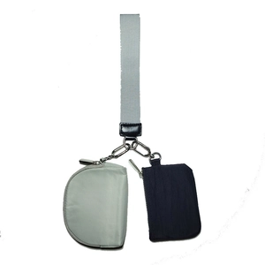 Detail of nylon wristlet pouch set with two zipper coin purses and a fabric strap