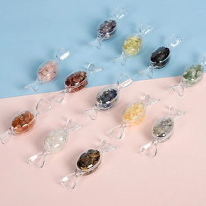 Natural crystal stones in transparent candy-shaped containers for desktop decoration