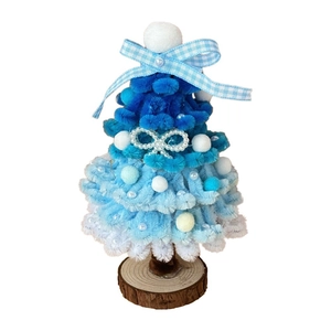 DIY Christmas tree desktop ornament made of blue pipe cleaners with pearls and bows