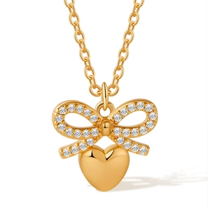 Detail of 18K gold-plated bow necklace featuring sparkling zircons and a polished heart