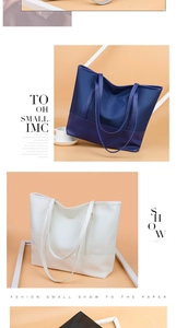Vertical view of large Oxford cloth tote bags in navy blue, cream white, and black colors