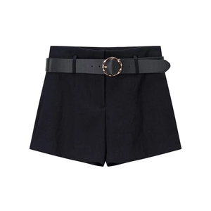 Women high waisted black shorts with golden buckle leather belt on white background