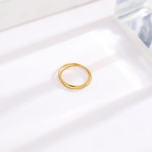 Minimalist gold titanium double-layered ring featuring twisted braid texture and smooth finish