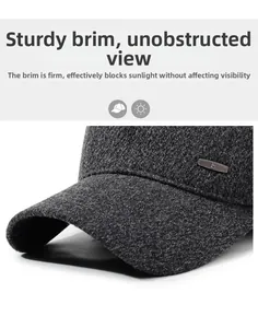 Detail of durable gray wool baseball cap brim with metallic decorative accent