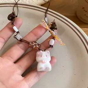 Maillard vintage acrylic star and kitten pendant necklace with brown woven rope strap