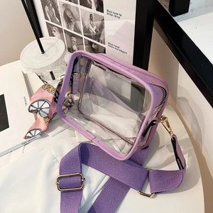 Purple transparent PVC crossbody jelly bag with wide strap and floral scarf accessory