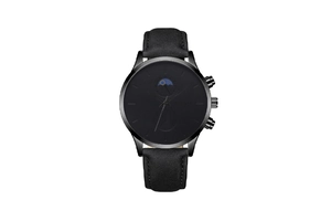 Detail view of the black moon phase quartz watch featuring a leather strap and three knobs