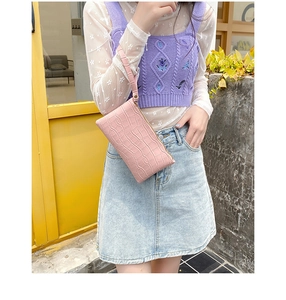 Pink faux leather wristlet bag with crocodile texture and metal zipper closure