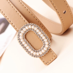 Fashionable beige leather belt with elegant rhinestone and pearl encrusted buckle