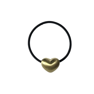 Minimalist elastic hair tie with a gold brushed alloy heart charm on a white background