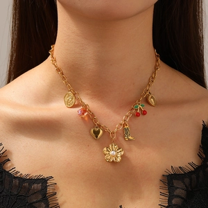 Gold chain necklace with floral, cherry, and boot charms and pearls for women