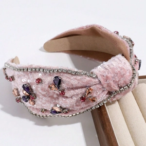 Elegant pink velvet knot headband with baroque rhinestone flower and butterfly patterns