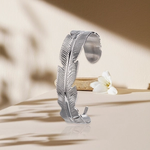 Vintage titanium steel feather open bangle in silver finish with detailed texture