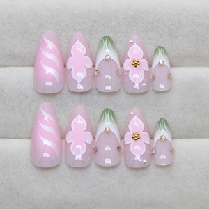Floral French press-on nails with metallic stripes and pearls in almond shape