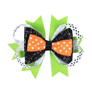 Halloween layered bow hair clip with orange polka dots and green glitter ribbons