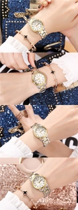 Detail of silver and gold quartz watch with rhinestones and clover bracelet on wrist