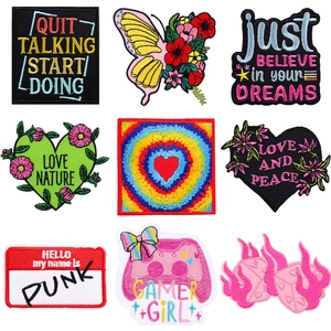 Set of nine colorful embroidered patches with heart, rainbow and text designs