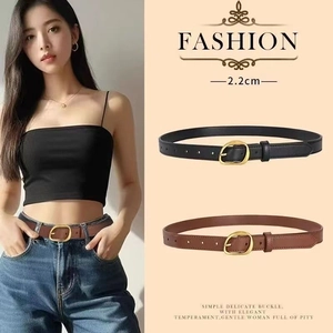 Detail shot of 2.2cm slim black and brown leather belts with gold metal buckle