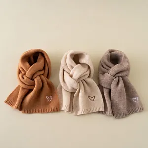 Winter knitted scarves for kids in caramel, cream, and oat colors with heart embroidery