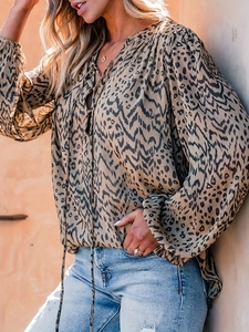 Women's casual leopard print long sleeve shirt with V-neck tie detail in earthy tones