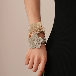 Exaggerated metal rose cuff bracelet with rhinestones in gold and silver finish
