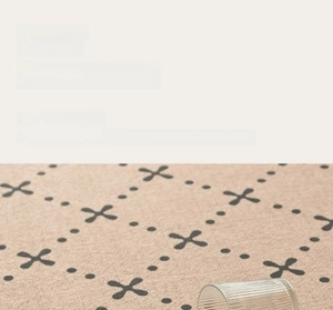 Detail of high-density waterproof looped velvet rug showing liquid beads on surface
