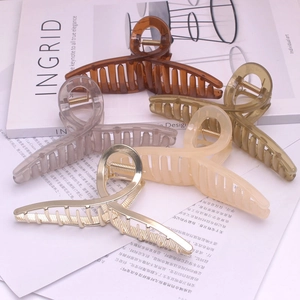 Elegant large hair claw clip set in gold alloy and translucent resin colors