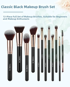 Detailed view of 12-piece makeup brush set with black handles and rose gold tubes