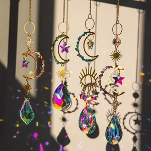 Golden suncatcher set with moon, star, and crystal prisms reflecting rainbow light