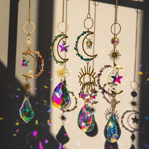 Golden suncatcher set with moon, star, and crystal prisms reflecting rainbow light