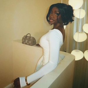 Elegant white long sleeve bodycon dress with backless design and slim fit cut