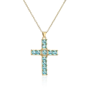 Elegant gold cross pendant necklace with blue square-cut gemstones and clear crystals