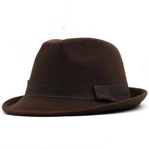 Side view of brown wool fedora hat showing textured felt fabric and ribbon detail