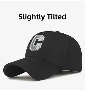 Close-up of a black baseball cap with 3D embroidered letter C and breathable mesh texture