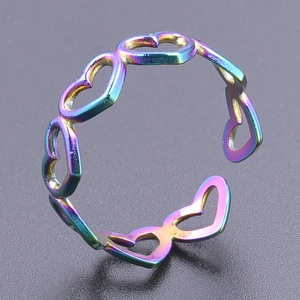 Detailed close-up of rainbow plated hollow heart ring with adjustable open band design