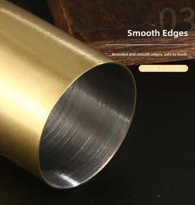 Macro detail of golden brushed stainless steel toothpick holder with smooth polished edges