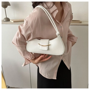 Close-up of white leather shoulder bag with gold metal buckle and knotted strap detail
