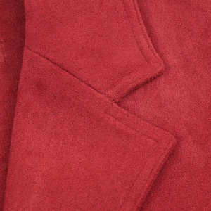 Close-up of red faux suede jacket showing collar stitching and premium fabric texture
