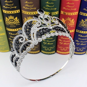 Detailed close-up of a silver baroque bridal crown with black and clear rhinestones
