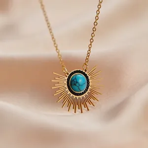 French vintage 14K gold-plated necklace featuring a radiant turquoise sunburst pendant