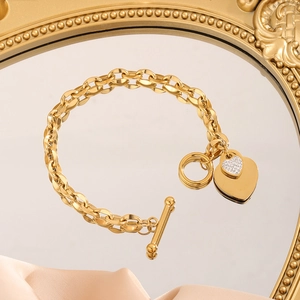 Gold stainless steel chain bracelet with OT toggle clasp and sparkling heart pendant