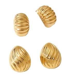 Polished golden stainless steel earrings with geometric ribbed and spiral textures