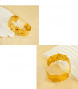 Detail view of gold-plated stainless steel cuff bracelet with hammered texture design