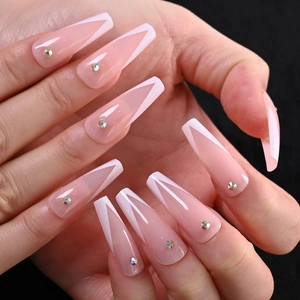 Detailed view of long ballerina French V-cut press-on nails with pink base and rhinestones