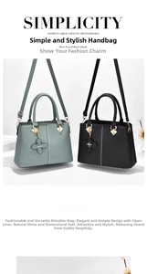 Detail of gray and black leather handbags with clover pendant and decorative studs