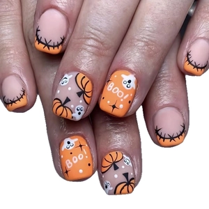 Halloween pumpkin press-on nails with ghost design and BOO lettering in matte finish