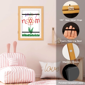 Detail view of magnetic kids art frame with 180-degree metal hinge and elastic straps